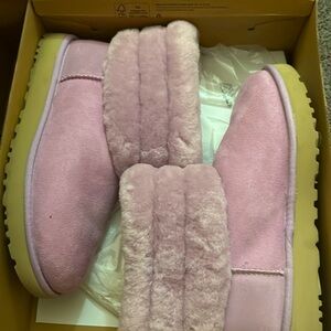 A UGG fur boot size 9 very soft and comfortable worn once.